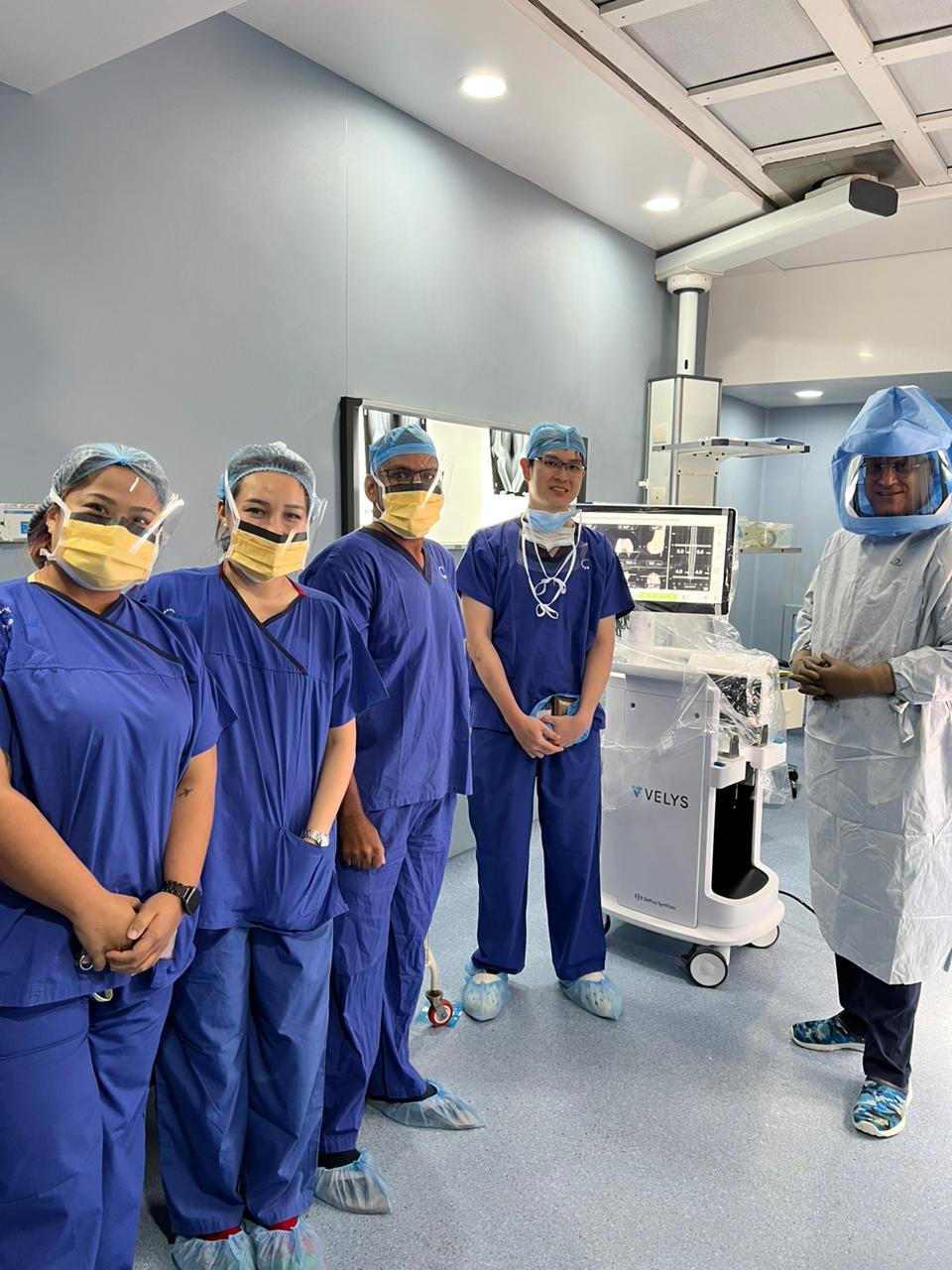 Surgical team with VELYS robot